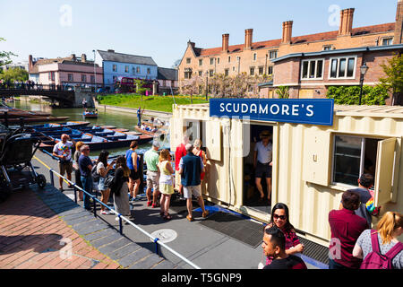 Tourists queue for tickets to punts on the River Cam at Scudamores rental office.  University town of Cambridge, Cambridgeshire, England