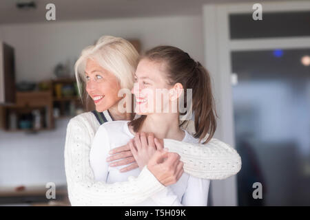 Happy mother and daughter together at home Stock Photo