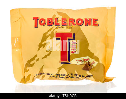 Winneconne, WI -  22 April 2019: A package of Toblerone tiny milk chocolate on an isolated background Stock Photo