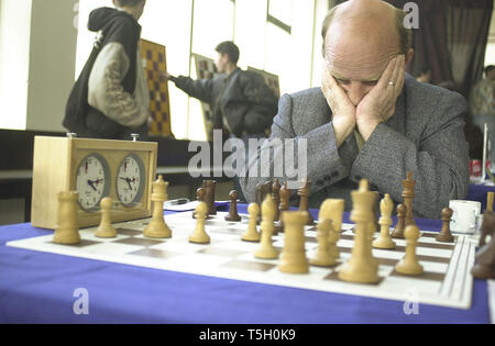 April 6, 2000 - Kosovo, Yugoslavia - A man contemplates his next move during a chess tournament in southern Kosovo, Yugoslavia, April 6, 2000. (Credit Image: © Bill Putnam/ZUMA Wire) Stock Photo