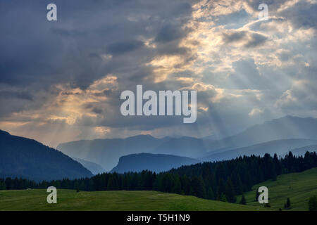 Rays of light break through clouds, Dolomites, Italy Stock Photo