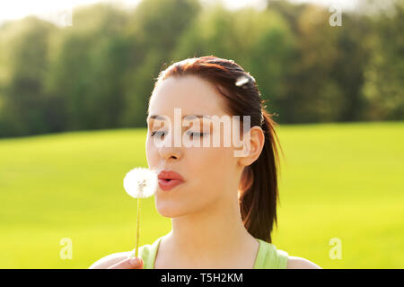 Spring Landscape With A Young Grass. Dandelion Flower. Focus Is On 