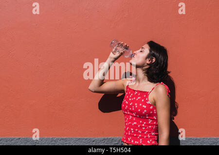 Young woman drinking water Stock Photo