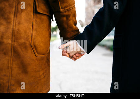 Close-up of couple holding hands Stock Photo