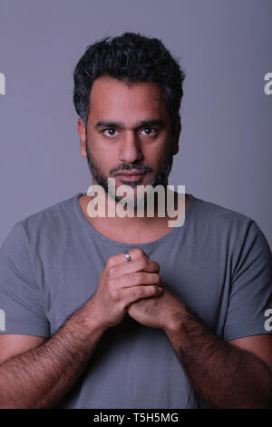 Portrait of an Indian man, looking serious Stock Photo
