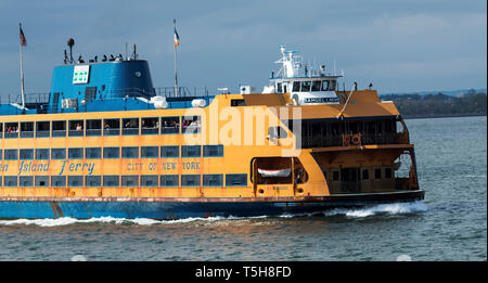 New York, USA - 15 October 2017: The Staten Island Ferry, which is free to travel on, leaving downtown NYC heading to Staten Island with the passanger Stock Photo