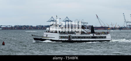 New York, USA - 15 October 2017: The Statue of Liberty cruise boats are full to capacity on a warm October day. Stock Photo