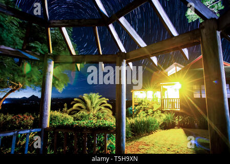 Star Trails Above House in Queensland Stock Photo