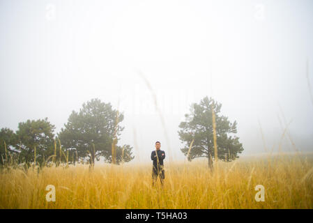 Man in Black Standing in Field Stock Photo