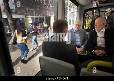 Labour leader Jeremy Corbyn takes the tram through Nottingham on his way to see an 'eco bus' in Nottingham, where the Labour council runs its own buses including a fleet of eco buses through Nottingham City Transport. Stock Photo