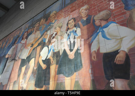 Berlin, Germany - part of the Socialist Realism mural painted in 1952 in then East Berlin DDR by artist Max Lingner Stock Photo