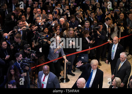 Massive crowd inside the Congress Center in Davos as the US President Donald J. Trump arrives to the World Economic Forum. former Secretary of State Rex Tillerson walks behind him. Stock Photo