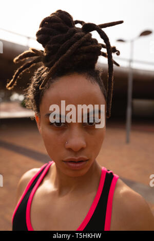 Fit young woman standing in the city Stock Photo