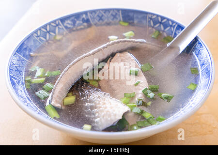 Milkfish skin soup, distinctive Taiwan delicacy food in Tainan. Famous meal set for lunch or breakfast with vegetable, top view, copy space, close up Stock Photo