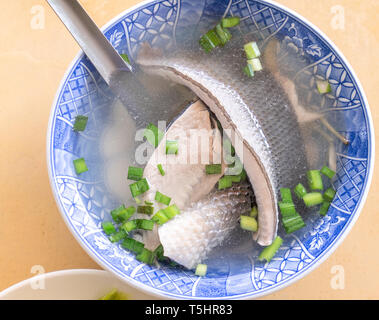 Milkfish skin soup, distinctive Taiwan delicacy food in Tainan. Famous meal set for lunch or breakfast with vegetable, top view, copy space, close up Stock Photo