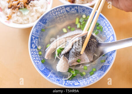 Milkfish skin soup, distinctive Taiwan delicacy food in Tainan. Famous meal set for lunch or breakfast with vegetable, top view, copy space, close up Stock Photo