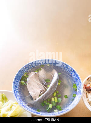 Milkfish skin soup, distinctive Taiwan delicacy food in Tainan. Famous meal set for lunch or breakfast with vegetable, top view, copy space, close up Stock Photo