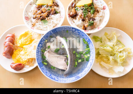 Milkfish skin soup, distinctive Taiwan delicacy food in Tainan. Famous meal set for lunch or breakfast with vegetable, top view, copy space, close up Stock Photo