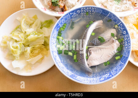 Milkfish skin soup, distinctive Taiwan delicacy food in Tainan. Famous meal set for lunch or breakfast with vegetable, top view, copy space, close up Stock Photo