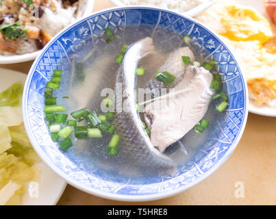 Milkfish skin soup, distinctive Taiwan delicacy food in Tainan. Famous meal set for lunch or breakfast with vegetable, top view, copy space, close up Stock Photo