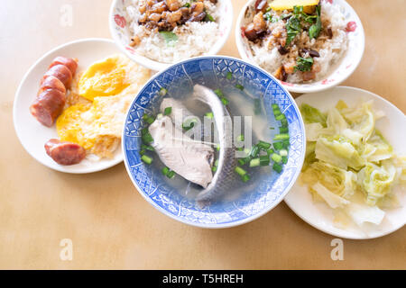 Milkfish skin soup, distinctive Taiwan delicacy food in Tainan. Famous meal set for lunch or breakfast with vegetable, top view, copy space, close up Stock Photo