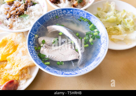 Milkfish skin soup, distinctive Taiwan delicacy food in Tainan. Famous meal set for lunch or breakfast with vegetable, top view, copy space, close up Stock Photo