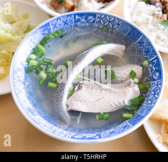 Milkfish skin soup, distinctive Taiwan delicacy food in Tainan. Famous meal set for lunch or breakfast with vegetable, top view, copy space, close up Stock Photo