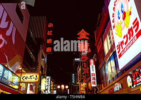 Neon illuminated signs and billboards of Dotonbori street at night in Osaka, Japan Stock Photo