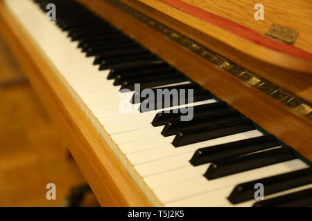 Black and white keys on the old piano. Stock Photo