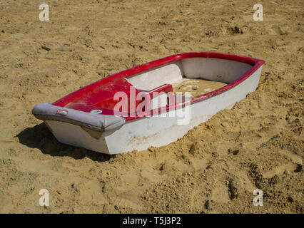 Small boat stranded in the sandpit Stock Photo