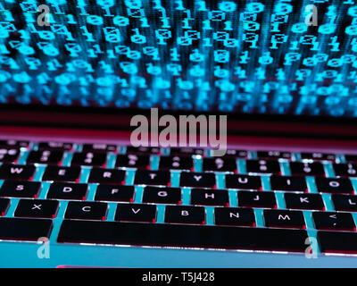 Computer virus infecting a laptop computer with a virus Stock Photo
