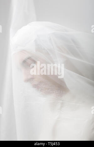 Graceful woman trapped in a veil Stock Photo