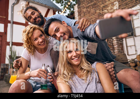 Friends having fun in a backyard in the summer Stock Photo