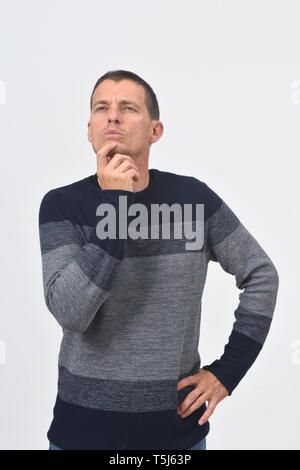 man having a doubt or question on white background Stock Photo