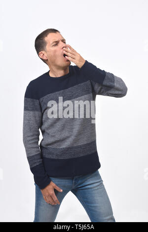 man yawning on white background Stock Photo