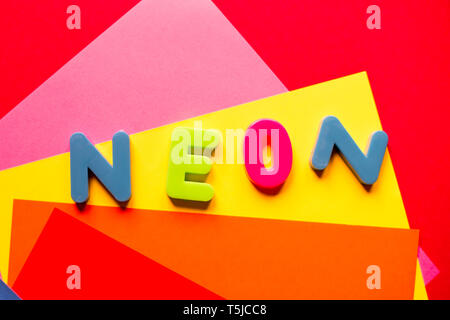 Neon word on multicolored background in trendy colors. Bright concept. Stock Photo