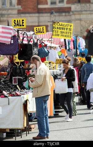 Shoppers going through the stalls at Barking Town Centre Market. East London. 24 April 2010. Stock Photo