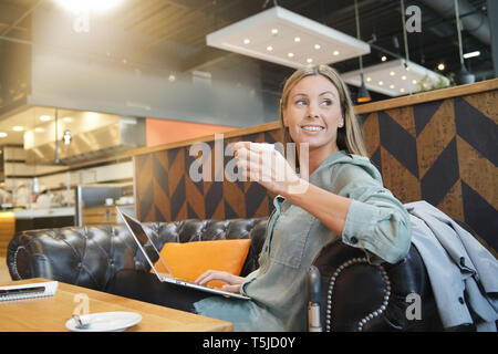 Saleswoman preparing sales pitch on work trip Stock Photo