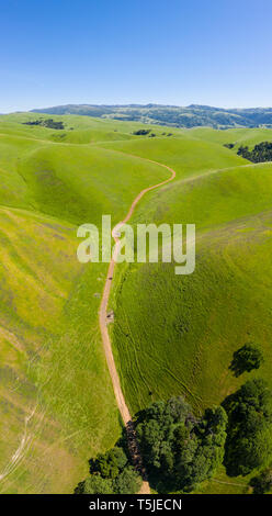 Aerial view of the lush green hills and dense tropical forest landscape ...