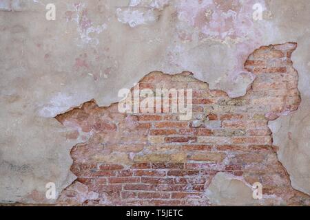 textured stucco wall and bricks Stock Photo