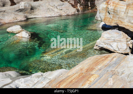 Switzerland, Ticino, Verzasca Valley, stones and rocks in clear turquoise waters of Verzasca river Stock Photo