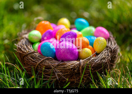 Sparkling Easter eggs in nest Stock Photo