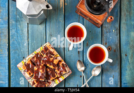 Homemade chocolate cake and two cups of tea Stock Photo