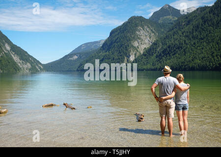 Germany, Bavaria, Koenigssee, couple standing in lake Stock Photo
