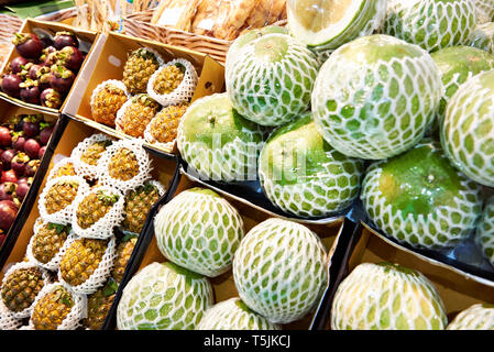 Fruits of pomelo and pineapple on the market counter Stock Photo