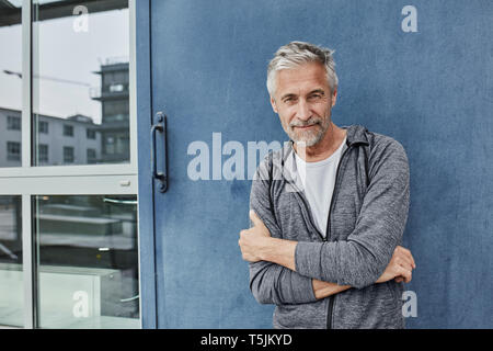 Portrait of mature man in front of gym Stock Photo