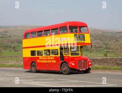 Iconic red AEC Routemaster double-decker buses parked on a street in ...