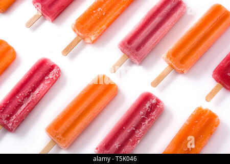 Orange and strawberry popsicles pattern isolated on white background.. Top view Stock Photo