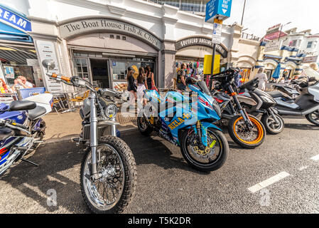 Motorbikes parked outside Pier Arches Cafes at the Southend Shakedown motorcycle rally, Southend on Sea, Essex, UK. Space for copy