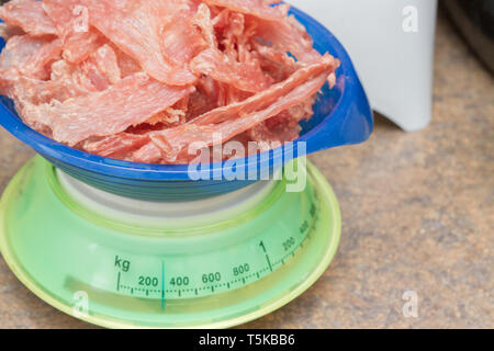 Scale with raw meat Stock Photo - Alamy